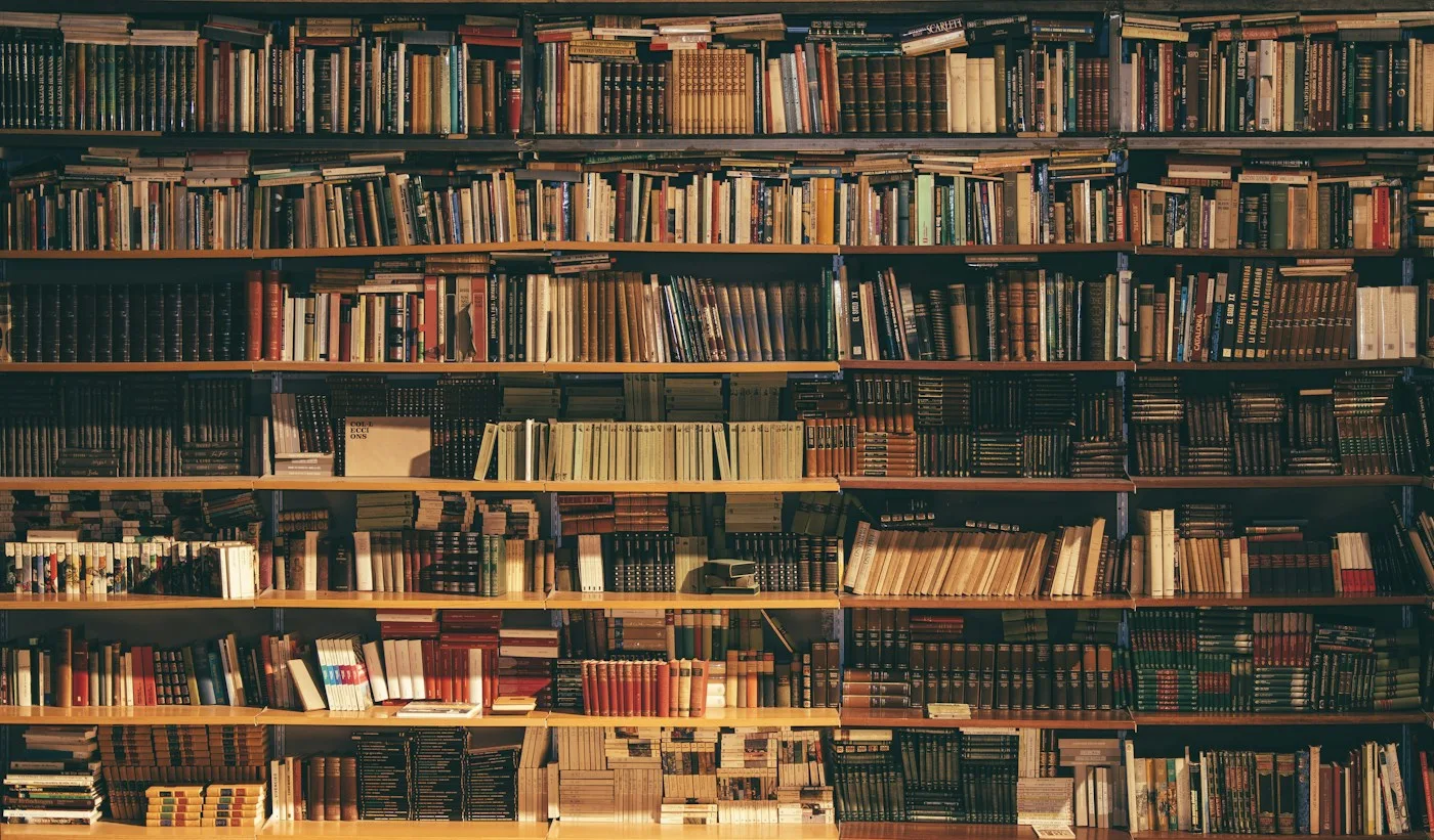 Tall library shelves filled with books