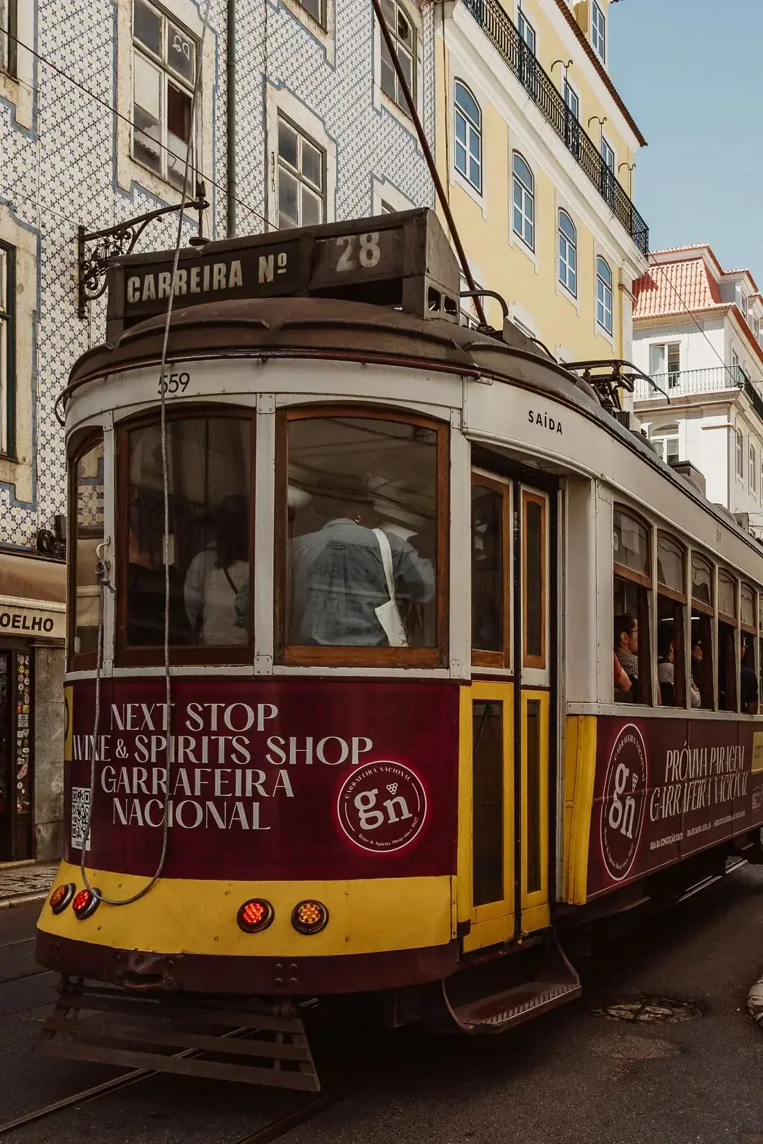 The wood-framed front windows of a historic tram in Lisbon
